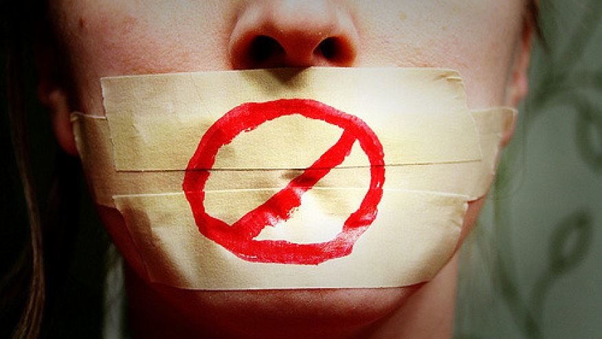 Mouth taped shut - No free speech