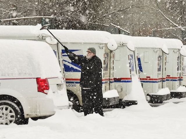 US postal worker removing snow