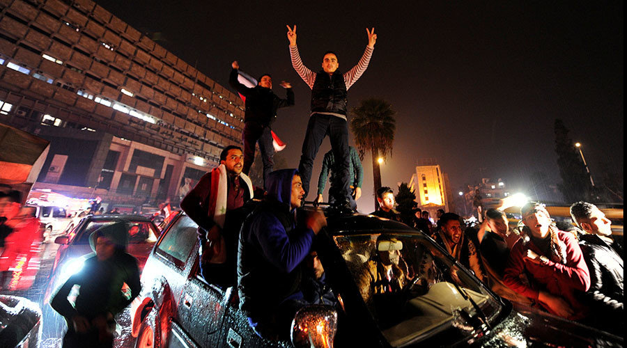 Click to enlarge Syrians celebrating