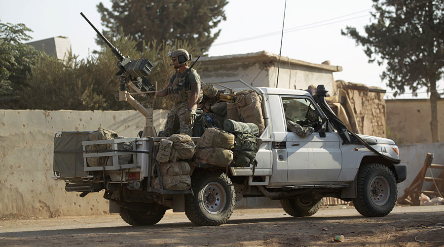 U.S soldiers ride a military vehicle in al-Kherbeh village, northern Aleppo province, Syria October 24, 2016