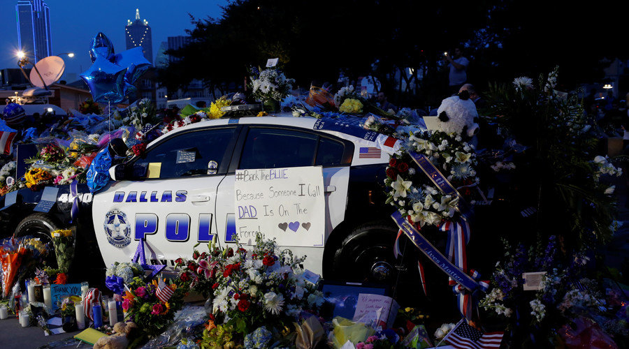 A makeshift memorial at Dallas Police Headquarters is seen one day after a lone gunman ambushed and killed five police officers at a protest decrying police shootings of black men, in Dallas, Texas, U.S., July 8, 2016.
