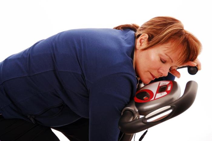 Click to enlarge woman on exercise bike