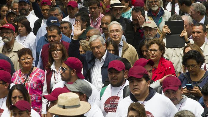 Andrés Manuel López Obrador waves to supporters