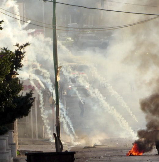 Click to enlarge The IDF attacks the area between the ‘Azza and Aida refugee camps, Bethlehem, as an ambulance (center, background) tries to rescue victims. December, 2015