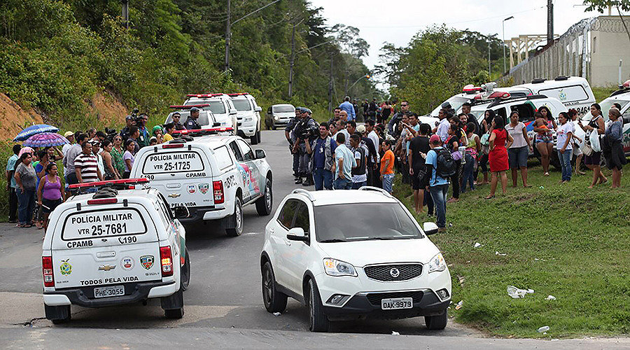 Relatives of inmates gather at the main gate of the Anisio Jobim Penitentiary Complex