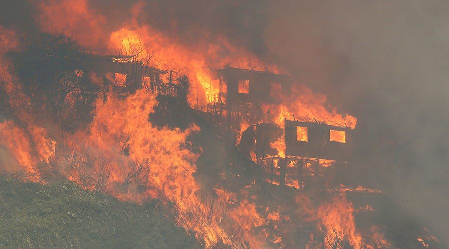 Fire burns a house on a hill, where more than 100 homes were burned due to forest fire but there have been no reports of death, local authorities said in Valparaiso, Chile January 2, 2017