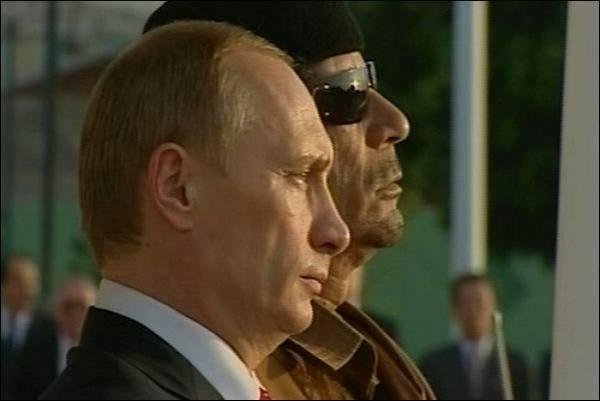 Vladimir Putin and Muammar Gaddafi