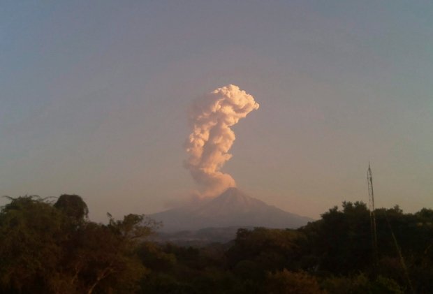 A large plume of ash rises from the crater of the Colima volcano, also known as the Volcano of Fire, on Saturday, Dec. 24, 2016.