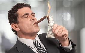 man lighting cigar with money