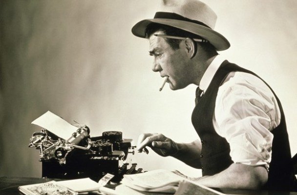 Old time reporter on a typewriter