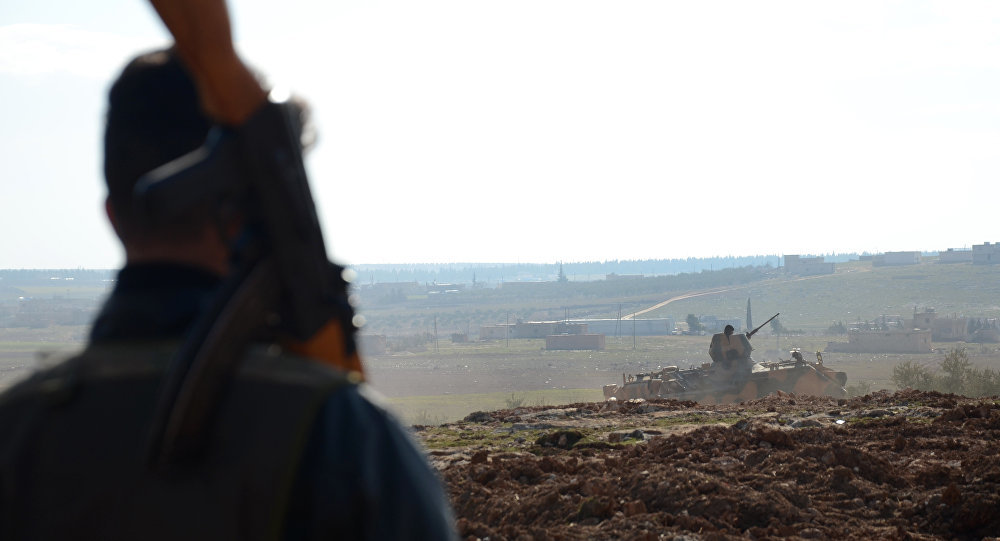 Click to enlarge Fighters from the Free Syrian Army monitor the area during battles against IS group jihadists near the town of Qabasin, located northeast of the city of Al-Bab