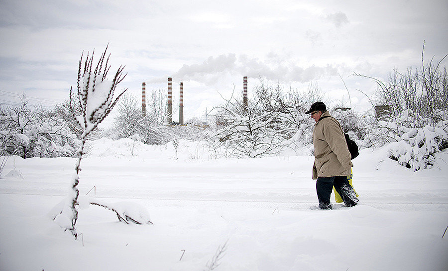Click to enlarge A man walks in a suburb of Sofia after heavy snowfall on January 7, 2017.