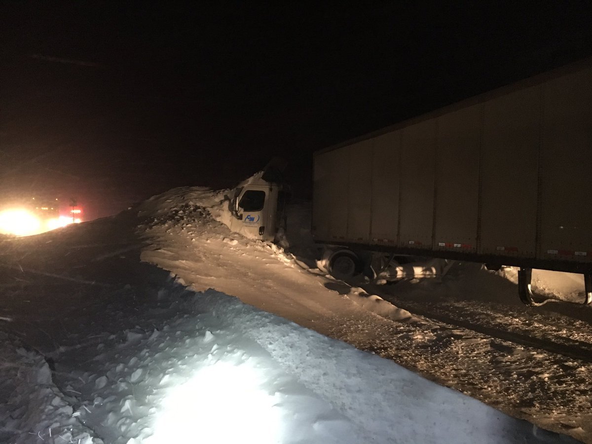 Click to enlarge 18-wheeler buried in an avalance