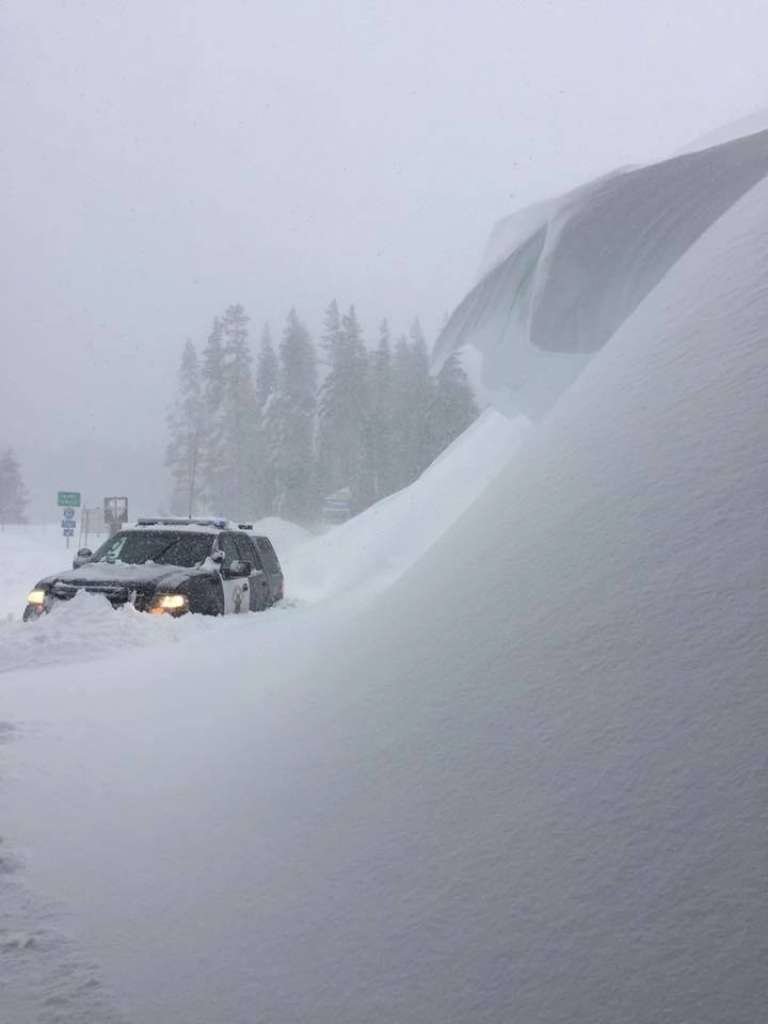 The CHP Turckee office shared this photo of a patrol vehicle parked next to a snow hill along I-80.