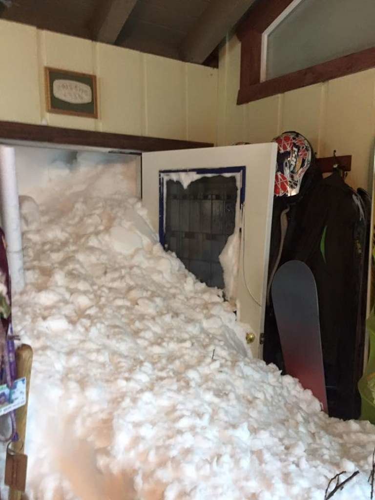 A controlled avalanche by officials hit homes in Alpine Meadows, causing snow to burst through the home of the Siig family, the residents said.