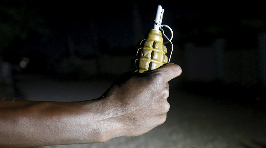 hand holding grenade