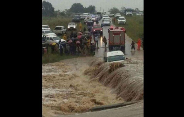 Click to enlarge A woman and a rescue worker drowned after a minibus taxi was trapped in floodwater in Frischgewaagd village in Mpumalanga on Saturday.