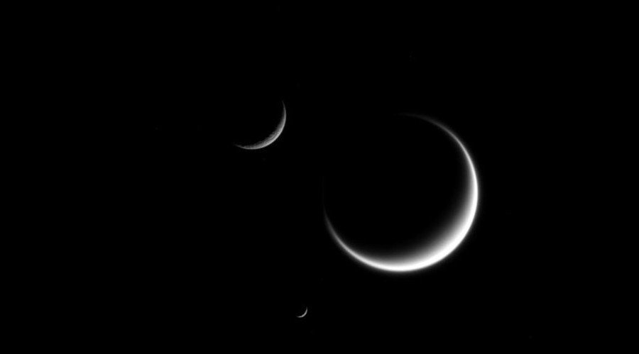 Click to enlarge Saturn's three crescent moons, Titan, Mimas and Rhea