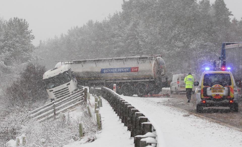 Traffic cops try to help the HGV out of the jam 