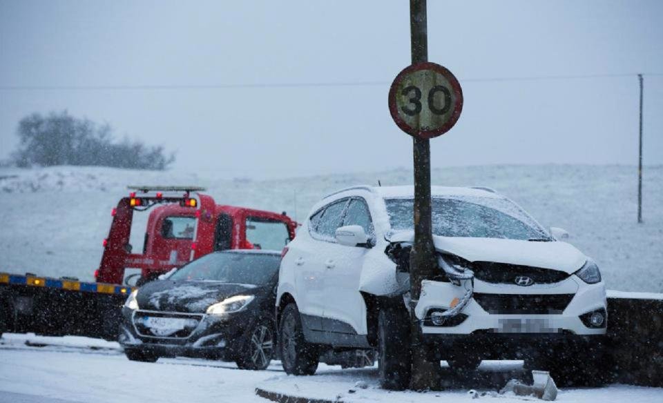 A car was left smashed up after it skidded into a lamppost in Lugton earlier today