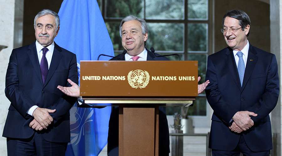 UN Secretary-General Antonio Guterres (C) speaks next to Greek Cypriot President Nicos Anastasiades (R) and Turkish Cypriot leader Mustafa Akinci