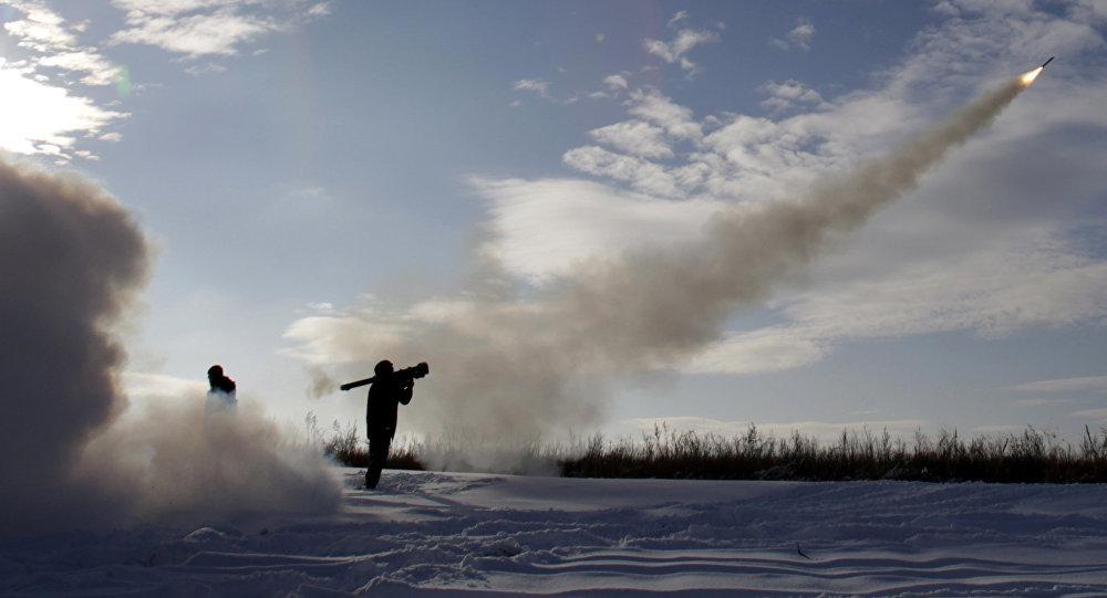 Ukrainian soldiers firing missile