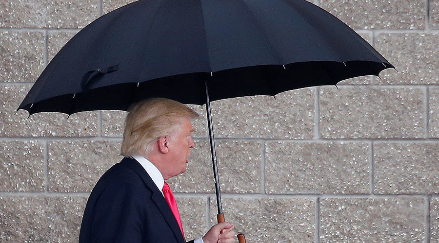 Click to enlarge Donald Trump with umberalla