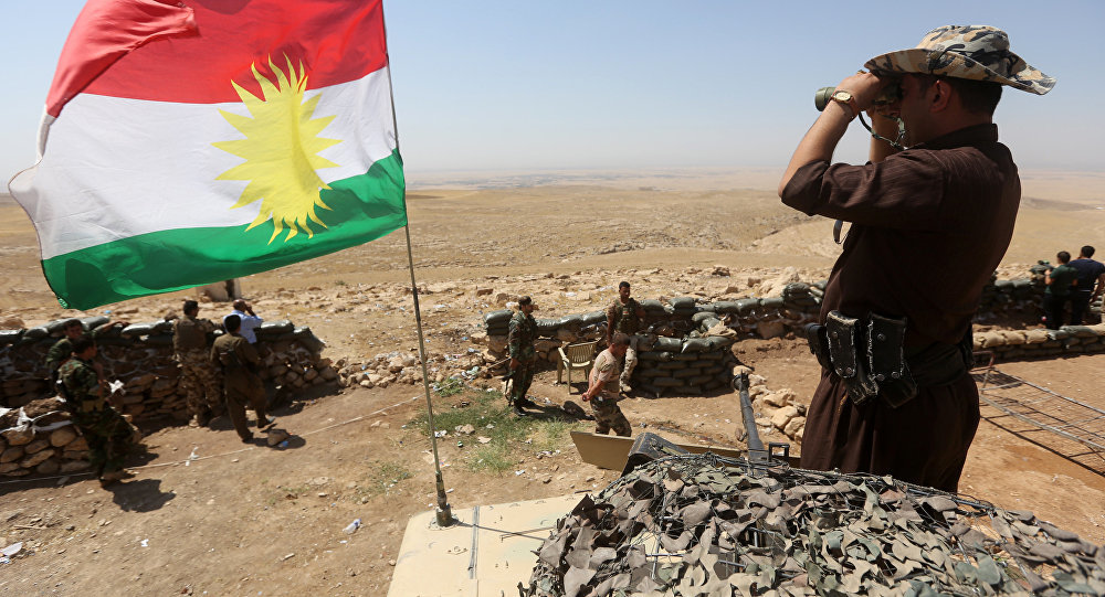Click to enlarge Iraqi Kurdish soldier with flag