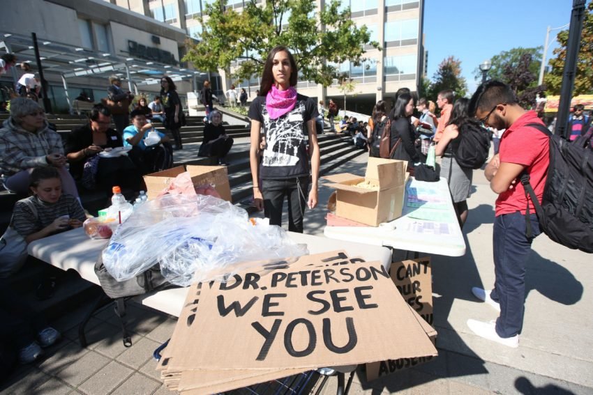 Click to enlarge Cassandra Williams, a U of T student union member, at a Peterson protest in October. Peterson sparked a storm by declaring he would not use pronouns, such as