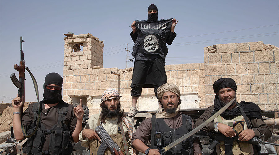 Click to enlarge Islamic state fighters on the border between Syria and Iraq