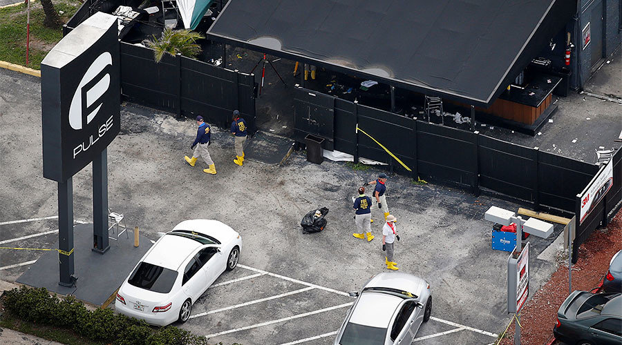 FBI officials collect evidence from the parking lot of the Pulse gay night club