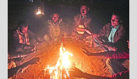 Day-laborers around fire in Bangladesh