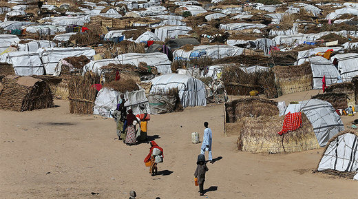 people seen moving within their thatched houses at the Muna Internally displace peoples camp in Maiduguri, Nigeria