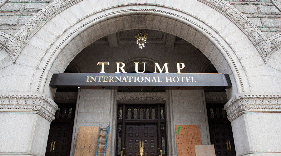 Plywood covers protest graffiti at an entrance to the Trump International Hotel in Washington, DC