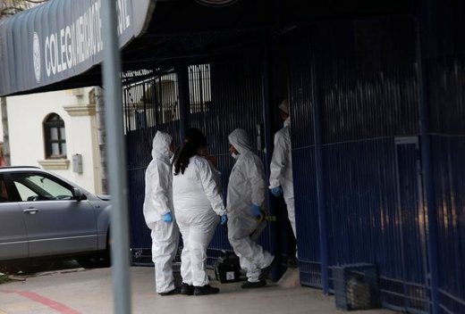 Click to enlarge Forensic technicians outside school