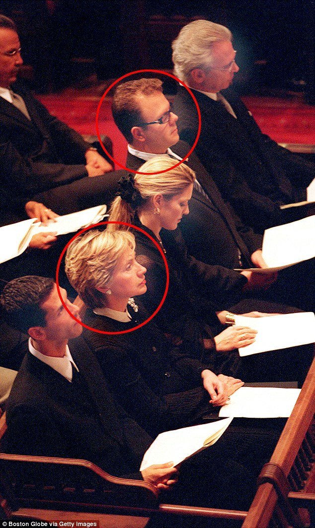 Hillary Clinton sits with the Puopolo family