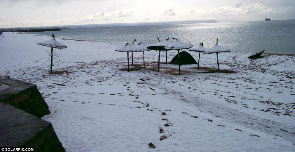 Snow on the beaches of Majorca where the freak weather has turned the island into a winter wonderland  