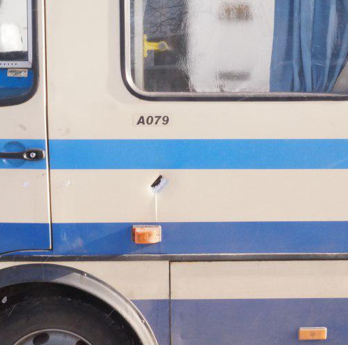 Shrapnel hole in side of Donetsk-Dokuchaevsk bus