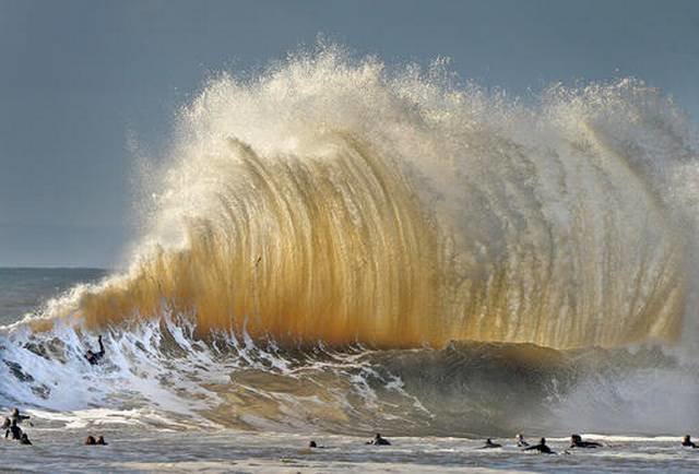 Click to enlarge Surfers enjoy the large waves at the entrance to Santa Barbara, Calif., harbor Saturday morning, Jan. 21, 2017. A winter storm is bringing much higher than usual waves to the area.