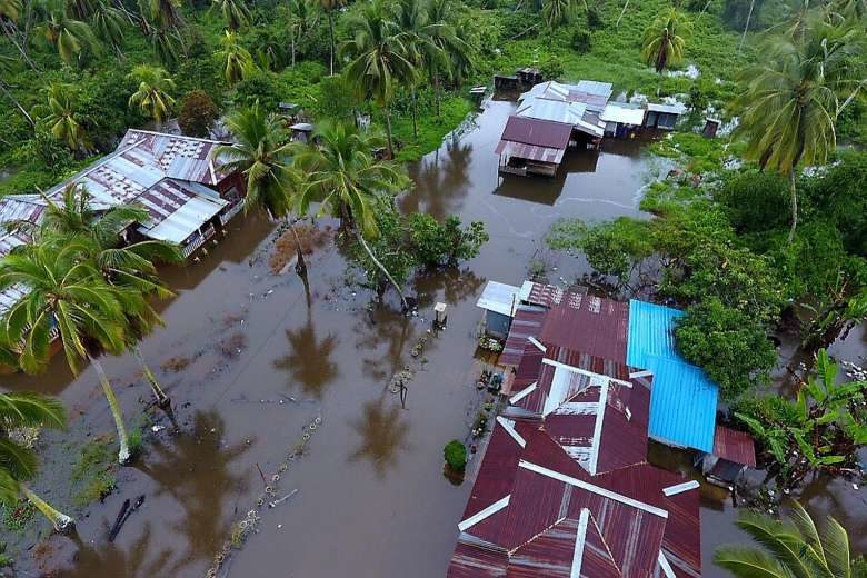 Floodwaters hit houses in a Perak village as three days of relentless rain in Malaysia brought floods to nine of the country's 13 states.