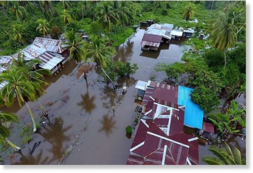 Floodwaters hit houses in a Perak village as three days of relentless rain in Malaysia brought floods to nine of the country's 13 states.