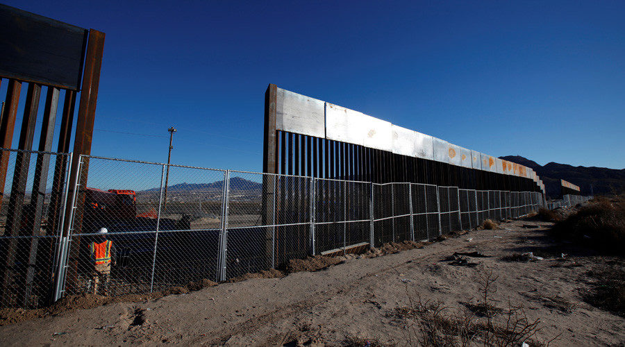 Click to enlarge A worker stands next to a newly built section of the U.S.-Mexico border fence at Sunland Park, U.S. opposite the Mexican border city of Ciudad Juarez