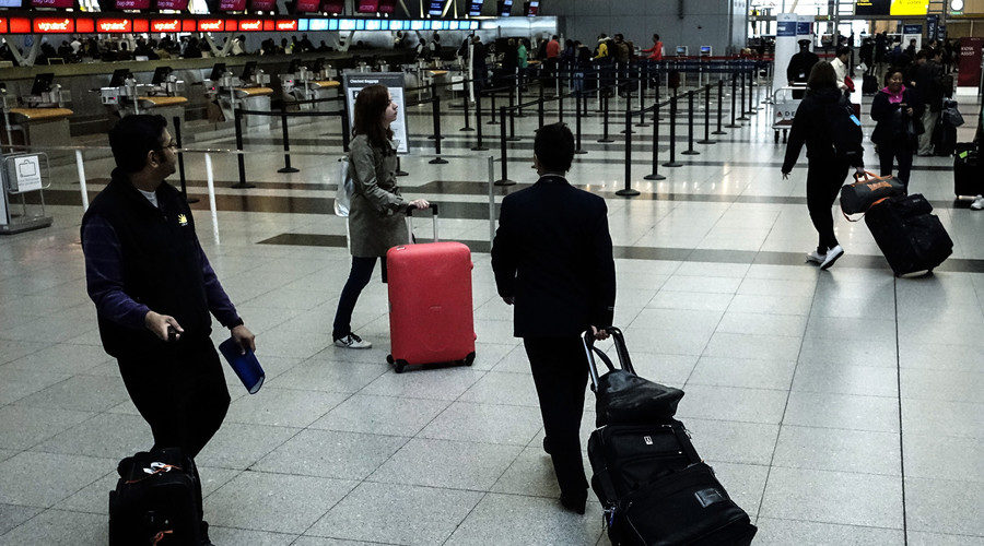 Passengers make their way at the International JFK airport in New York