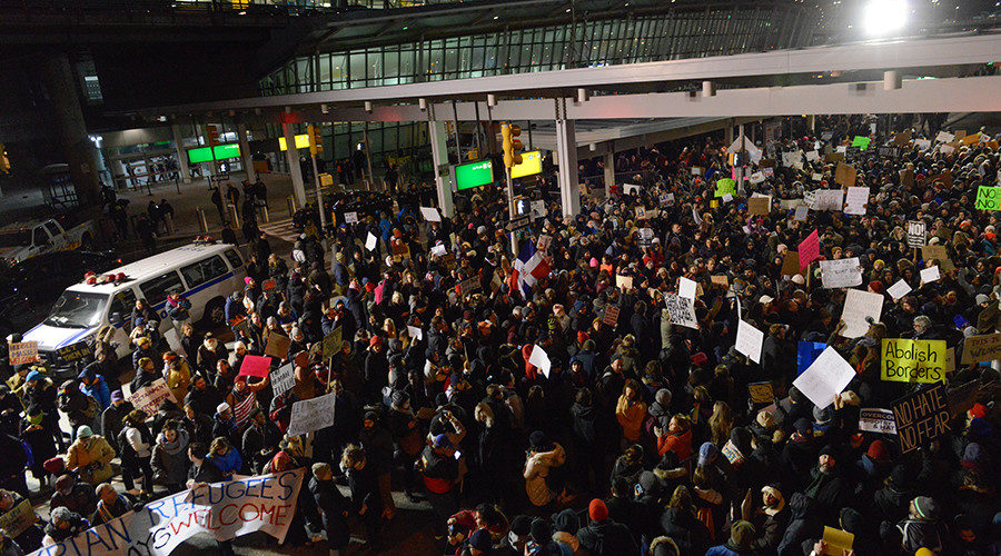 Click to enlarge Protestors rally during a demonstration against the new immigration ban issued by President Donald Trump at John F. Kennedy International Airport on January 28, 2017 in New York City