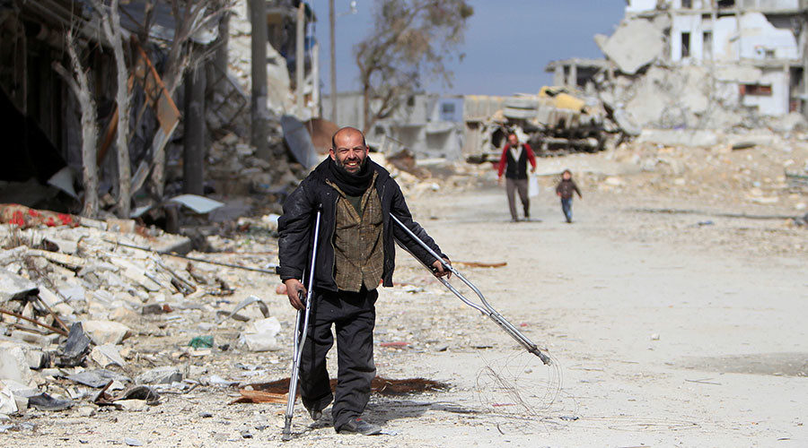 Click to enlarge man on crutches Aleppo