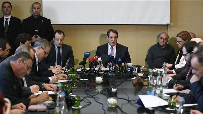 Greek Cypriot President Nicos Anastasiades, center, gives a press conference