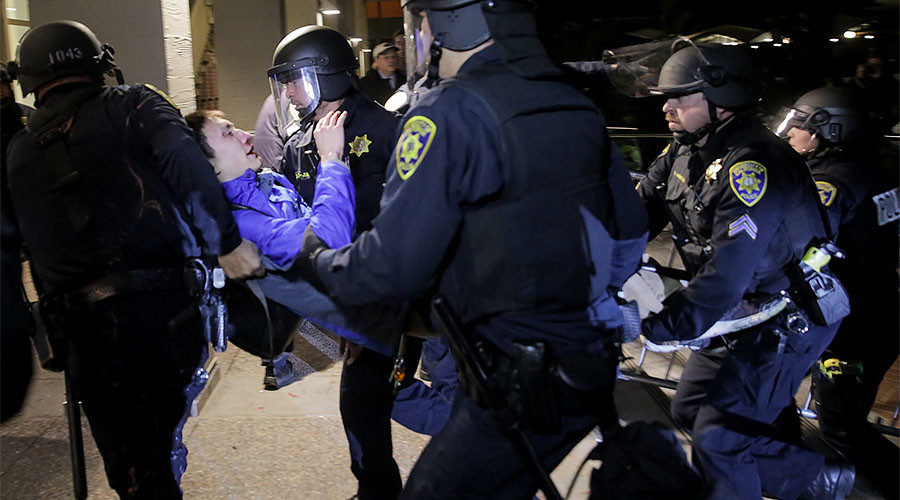Protester being carried by UCB police