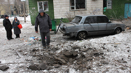 Civilian residents of Donetsk near their home