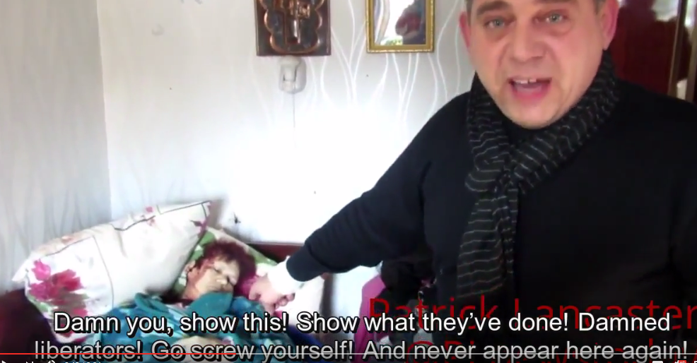 Donetsk man pointing to his recently killed mother