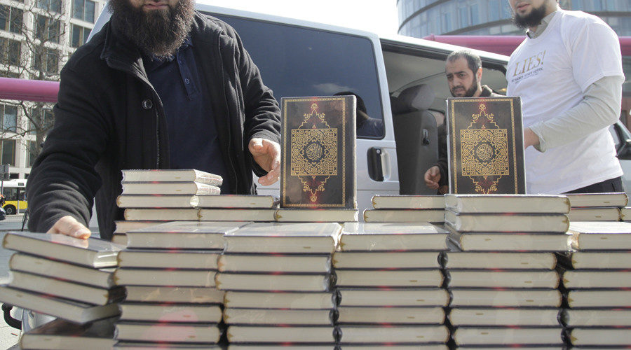 Click to enlarge Salafist Muslims distribute German Koran